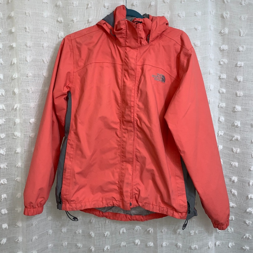 Neon pink Women's North Face Rain Jacket.